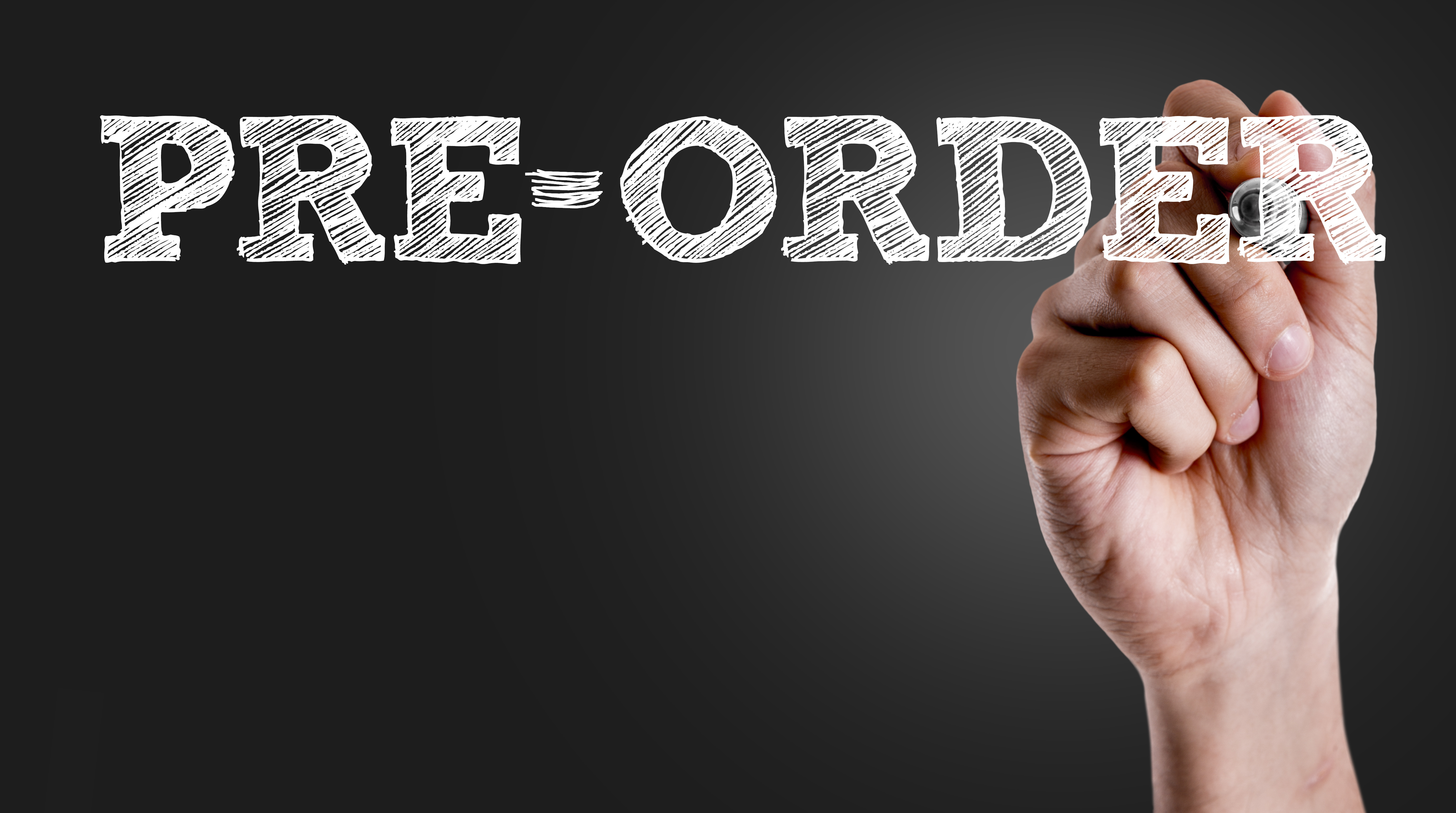 Hand writing the text: Pre-Order