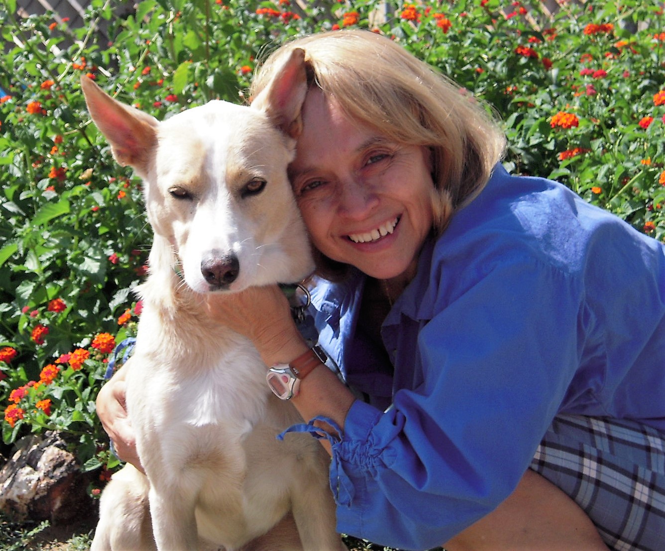 LC Hayden and dog hugging image